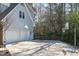 Features a two-car garage, well-lit driveway, basketball hoop, and neatly landscaped surroundings at 5220 Linksland Dr, Holly Springs, NC 27540