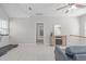 Spacious loft area with treadmill, tv, and carpet at 5220 Linksland Dr, Holly Springs, NC 27540