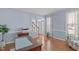 Comfortable office with hardwood floors, natural light, and a view of the front yard from the large windows at 5220 Linksland Dr, Holly Springs, NC 27540