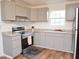Newly remodeled kitchen with granite countertops and stainless steel appliances at 540 S Cheatham St, Franklinton, NC 27525