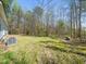 The backyard of the home with level ground features an installed air conditioning unit at 55 J B Rd, Louisburg, NC 27549
