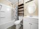 Bathroom showcasing a shower over tub, a white vanity, and stylish floating shelves at 55 J B Rd, Louisburg, NC 27549