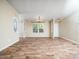Inviting living room with natural light, wood-look floors, and a neutral color palette at 55 J B Rd, Louisburg, NC 27549