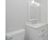 Bathroom featuring a white vanity with marble countertop and modern lighting fixtures at 5917 Meadowlark Ln, Raleigh, NC 27610