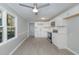 Modern kitchen with white cabinets, tile backsplash, stainless steel appliances, and gray walls at 5917 Meadowlark Ln, Raleigh, NC 27610