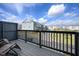 Townhome deck overlooking community street featuring lawn chairs and a privacy fence at 5918 Giddings St, Raleigh, NC 27616