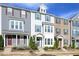 Charming townhome exterior featuring blue shutters and a well-manicured lawn, offering curb appeal at 5918 Giddings St, Raleigh, NC 27616