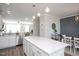 Bright kitchen with stainless steel appliances, lots of counter space, and bar stool seating at 5918 Giddings St, Raleigh, NC 27616