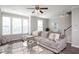 Comfortable living room with ceiling fan, plush sectional sofa, and lots of natural light at 5918 Giddings St, Raleigh, NC 27616
