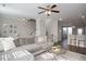 Spacious living room with open floor plan, ceiling fan, and access to the kitchen at 5918 Giddings St, Raleigh, NC 27616