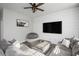 Comfortable living room with shiplap accent wall, a large TV, and a sectional sofa for relaxation at 5918 Giddings St, Raleigh, NC 27616