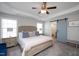 Serene main bedroom with comfortable bed, natural light, and en suite bathroom at 5918 Giddings St, Raleigh, NC 27616