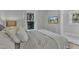 Comfortable bedroom featuring a window view, ceiling fan, and hardwood floors at 602 Dunbar St, Durham, NC 27701