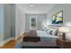 Stylish bedroom featuring hardwood floors, a bright window view, and closet space at 602 Dunbar St, Durham, NC 27701