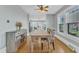 Bright dining room featuring hardwood floors, a stylish dining table, and ample natural light at 602 Dunbar St, Durham, NC 27701