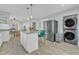 Modern kitchen with breakfast bar, stainless steel appliances, and access to the dining room at 602 Dunbar St, Durham, NC 27701