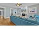 Inviting living room with a fireplace, hardwood floors, and a comfortable blue sofa at 602 Dunbar St, Durham, NC 27701
