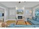 Cozy living room featuring a fireplace, hardwood floors, and comfortable seating area at 602 Dunbar St, Durham, NC 27701