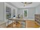 Sun-filled home office with hardwood floors and large windows looking out to the yard at 602 Dunbar St, Durham, NC 27701