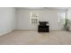 A spacious bedroom with carpet, white walls, and two windows allowing for plenty of natural light at 6021 Watsonia Dr, Zebulon, NC 27597
