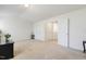 Spacious, carpeted bedroom with ample closet space and natural light at 6021 Watsonia Dr, Zebulon, NC 27597