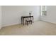 Bedroom with neutral carpet, natural light, and an antique writing desk at 6021 Watsonia Dr, Zebulon, NC 27597