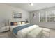 Bright bedroom featuring natural light, neutral walls, and modern decor at 6021 Watsonia Dr, Zebulon, NC 27597