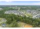 Expansive aerial view of a residential neighborhood, highlighting its setting and design at 622 Lone Pine Loop, Fuquay Varina, NC 27526