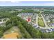 An aerial view showcases the neighborhood's layout and proximity to surrounding nature at 622 Lone Pine Loop, Fuquay Varina, NC 27526