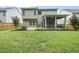 A well-maintained backyard with a covered patio and lush green lawn, ideal for relaxing and entertaining outdoors at 622 Lone Pine Loop, Fuquay Varina, NC 27526