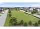 Well-maintained common area featuring lush green space and beautiful landscaping throughout at 622 Lone Pine Loop, Fuquay Varina, NC 27526