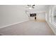Large living area with hardwood floors, fireplace, and windows at 622 Lone Pine Loop, Fuquay Varina, NC 27526