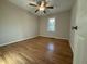 Peaceful bedroom with hardwood floors, a ceiling fan, and ample natural light at 640 Crocker Rd, Smithfield, NC 27577
