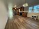 Kitchen with dark cabinets, stainless appliances and hardwood style floors at 640 Crocker Rd, Smithfield, NC 27577