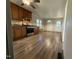 Kitchen with stainless appliances, dark cabinets, hardwood style floors and a gas heater at 640 Crocker Rd, Smithfield, NC 27577