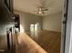 Bright and airy living room with gleaming hardwood floors and a modern ceiling fan at 640 Crocker Rd, Smithfield, NC 27577