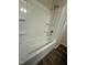 Shower and tub combination with shelves for storage at 640 Crocker Rd, Smithfield, NC 27577