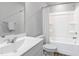 A full bathroom with a shower and tub combination and a modern sink at 6412 Nurture Ave, Raleigh, NC 27616