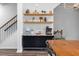 Dining area featuring floating shelves and modern furniture perfect for hosting gatherings at 6412 Nurture Ave, Raleigh, NC 27616