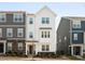 Charming, new construction two-story home featuring a landscaped yard, classic windows, and neutral color palette at 6412 Nurture Ave, Raleigh, NC 27616