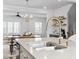 Modern kitchen featuring stainless steel appliances, a breakfast bar, and open sight lines to the dining area at 6412 Nurture Ave, Raleigh, NC 27616