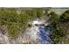 Aerial view of the home sitting on a snow-covered lot with green trees at 6509A Fowler Rd, Zebulon, NC 27597