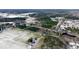 An aerial view of a large, snow-dusted lot surrounded by trees and fields at 6509A Fowler Rd, Zebulon, NC 27597