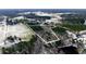 Aerial view showcasing the expansive lot with mixed trees and open fields, partially covered in snow at 6509A Fowler Rd, Zebulon, NC 27597