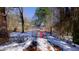 Shared driveway leading to property with lots 1 & 2 access, snow-covered in winter at 6509A Fowler Rd, Zebulon, NC 27597