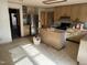 Traditional-style kitchen features wood cabinets, stainless steel refrigerator, and kitchen island at 6509A Fowler Rd, Zebulon, NC 27597