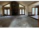 Spacious living room with large fireplace and many doors at 6509A Fowler Rd, Zebulon, NC 27597