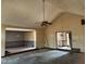 Spacious living room features high ceilings, ceiling fan, and open access to dining and entry areas at 6509A Fowler Rd, Zebulon, NC 27597