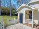 Backyard of home with a white picket fence and black backdoor at 7109 River Birch Dr, Raleigh, NC 27613
