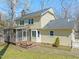 Exterior home view with a well-kept backyard, patio and a lush green lawn at 7109 River Birch Dr, Raleigh, NC 27613